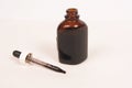 Glass bottle, brown with eye dropper Royalty Free Stock Photo