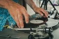 Vintage look deejay with vinyl in hands