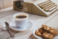 Vintage looking coffee and typing machine on a desk