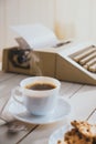 Vintage looking coffee and typing machine on a desk