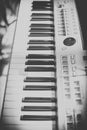 Vintage looking Detail of black and white keys on music keyboard