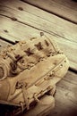 Vintage Looking Sepia Antique Baseball Glove on Wood Royalty Free Stock Photo