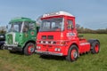 2 vintage lorries parked at a classic car meet