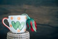 Vintage love cup with rose on retro background. Royalty Free Stock Photo