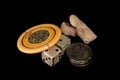 Vintage lucky charms. Antique poker chip, dice, squashed sixpences and coral.