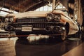 Vintage luxury car parked in a showroom in Brussels, Belgium.