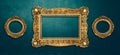 Vintage luxury golden frames set with ornate baroque decoration on rustic textured wall background Royalty Free Stock Photo