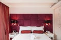 Vintage luxury interior hotel room, bed and well design lamp