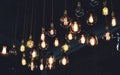 Vintage luxury light lamp hanging decor glowing in dark. Royalty Free Stock Photo