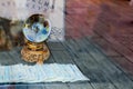 Vintage magic crystal ball with tarot cards on blurred wooden table background. Royalty Free Stock Photo