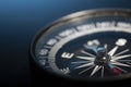 Vintage Magnetic compass compass on blue background. Macro photo Royalty Free Stock Photo