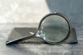 Vintage magnifier on dark background, side view