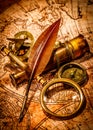 Vintage magnifying glass lies on an ancient world map Royalty Free Stock Photo