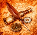 Vintage magnifying glass lies on an ancient world map Royalty Free Stock Photo