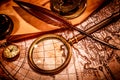 Vintage magnifying glass lies on an ancient world map Royalty Free Stock Photo