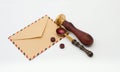 Vintage mail kraft envelope, sealing wax and seal on a white background Royalty Free Stock Photo