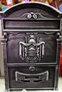 Vintage mailbox with antique embossed emblem closeup