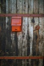 Vintage mailbox on wooden fence background Royalty Free Stock Photo