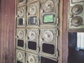 Vintage Brass Door Mailboxes on a Wooden Wall