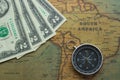 Vintage map of South America with two dolor bills and a compass, close-up