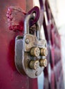 Vintage mechanical combination lock hanging on doors Royalty Free Stock Photo