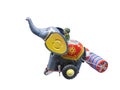 Vintage mechanical toy in the from of an elephant with a road roller . Isolated on a white background Royalty Free Stock Photo