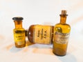 Vintage Medicine Bottles: Lapisvand, Glandula Lupuli, and Aqua Bardanea F.D.A. on White Background