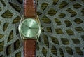 Vintage men`s watch, brown-gold color in close up shot