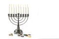 Jewish holiday hanukkah celebration with vintage menorah, dreidels and chocolate coins on a white background Royalty Free Stock Photo