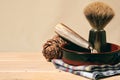 Vintage mens shaving equipment, razor blade, brush and bowl on the wooden table Royalty Free Stock Photo