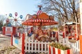 Vintage Merry-Go-Round flying horse carousel in amusement holliday park Royalty Free Stock Photo