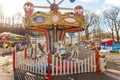 Vintage Merry-Go-Round flying horse carousel in amusement holliday park