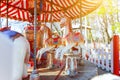 Vintage Merry-Go-Round flying horse carousel in amusement holliday park Royalty Free Stock Photo