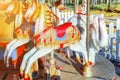 Vintage Merry-Go-Round flying horse carousel in amusement holliday park Royalty Free Stock Photo