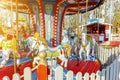 Vintage Merry-Go-Round flying horse carousel in amusement holliday park Royalty Free Stock Photo