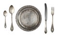 Vintage metal antique plate, spoon and fork isolated on a white background.