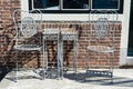 Vintage metal bistro table and chairs set in outdoor cafe Royalty Free Stock Photo