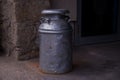 Vintage metal can for milk container in the farm. Royalty Free Stock Photo