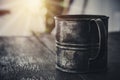 vintage metal coffee cup of the military on the old dark wooden table Royalty Free Stock Photo