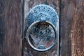 Vintage metal iron door handle on an old door made of natural wood. Horizontal orientation, selective focus. Doorknocker Royalty Free Stock Photo