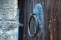 Vintage metal iron door handle on an old door made of natural wood. Horizontal orientation, selective focus. Doorknocker Royalty Free Stock Photo