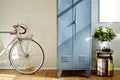 Vintage metal locker bike and vivid decoration in whitebrick studio Royalty Free Stock Photo