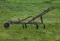 old metal plow used in rural areas with animals Royalty Free Stock Photo
