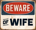 Vintage Rusty Beware of Wife Metal Sign. Royalty Free Stock Photo
