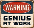 Vintage Rusty Warning Genius At Work Metal Sign.