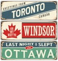 Vintage metal signs collection with Canada cities.