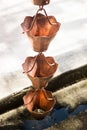 Vintage metallic bells used for rain waters way-out in zen garden