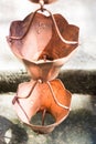 Vintage metallic bells used for rain waters way-out in zen garden