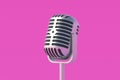 Vintage metallic microphone on pink background. Radio broadcast. Online streaming Royalty Free Stock Photo