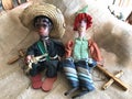 Vintage Mexican and Handmade Hippie Puppet Marionette Toys on Burlap Background